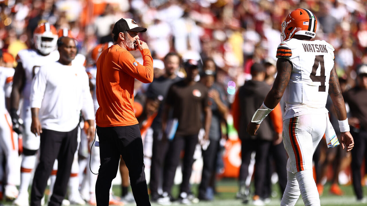 LANDOVER, MARYLAND - OCTOBER 06: Head coach Kevin Stefanski and Deshaun Watson #4 of the Cleveland Browns speak against the Washington Commanders at Northwest Stadium on October 06, 2024 in Landover, Maryland.