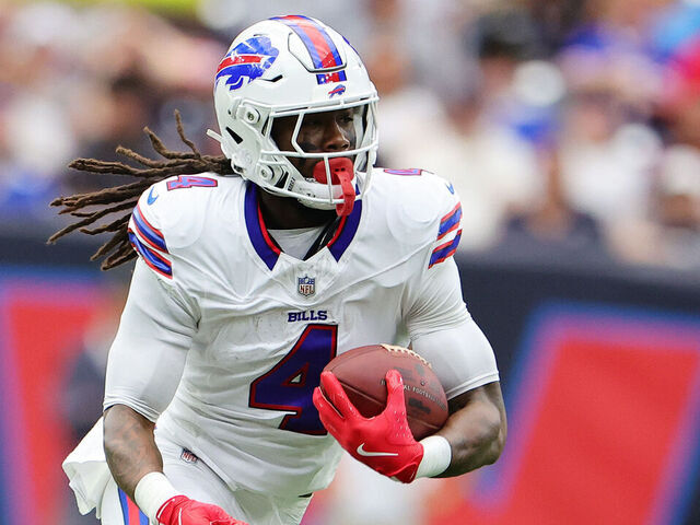 HOUSTON, TEXAS - OCTOBER 06: James Cook #4 of the Buffalo Bills carries against the Houston Texans during the first half at NRG Stadium on October 06, 2024 in Houston, Texas.