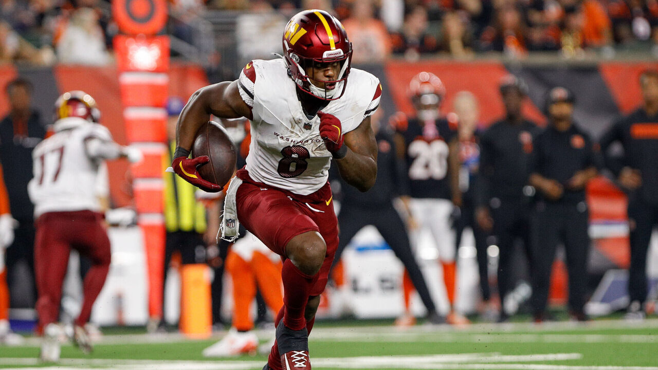 CINCINNATI, OH - SEPTEMBER 23: Washington Commanders running back Brian Robinson Jr. (8) carries the ball during the game against the Washington Commanders and the Cincinnati Bengals on September 23, 2024, at Paycor Stadium in Cincinnati, OH.