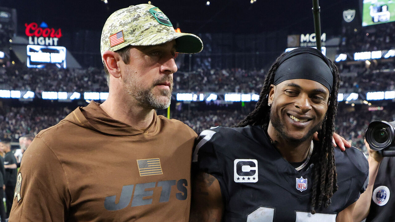 LAS VEGAS, NEVADA - NOVEMBER 12: Quarterback Aaron Rodgers #8 of the New York Jets and wide receiver Davante Adams #17 of the Las Vegas Raiders visit on the field after the Raiders' 16-12 victory over the Jets at Allegiant Stadium on November 12, 2023 in Las Vegas, Nevada.