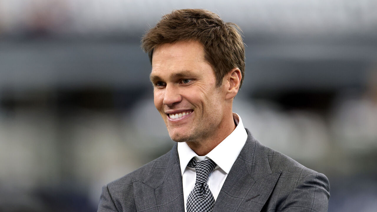 ARLINGTON, TEXAS - OCTOBER 13: Tom Brady, former NFL quarterback, looks on before the Detroit Lions play the Dallas Cowboys at AT&T Stadium on October 13, 2024 in Arlington, Texas.