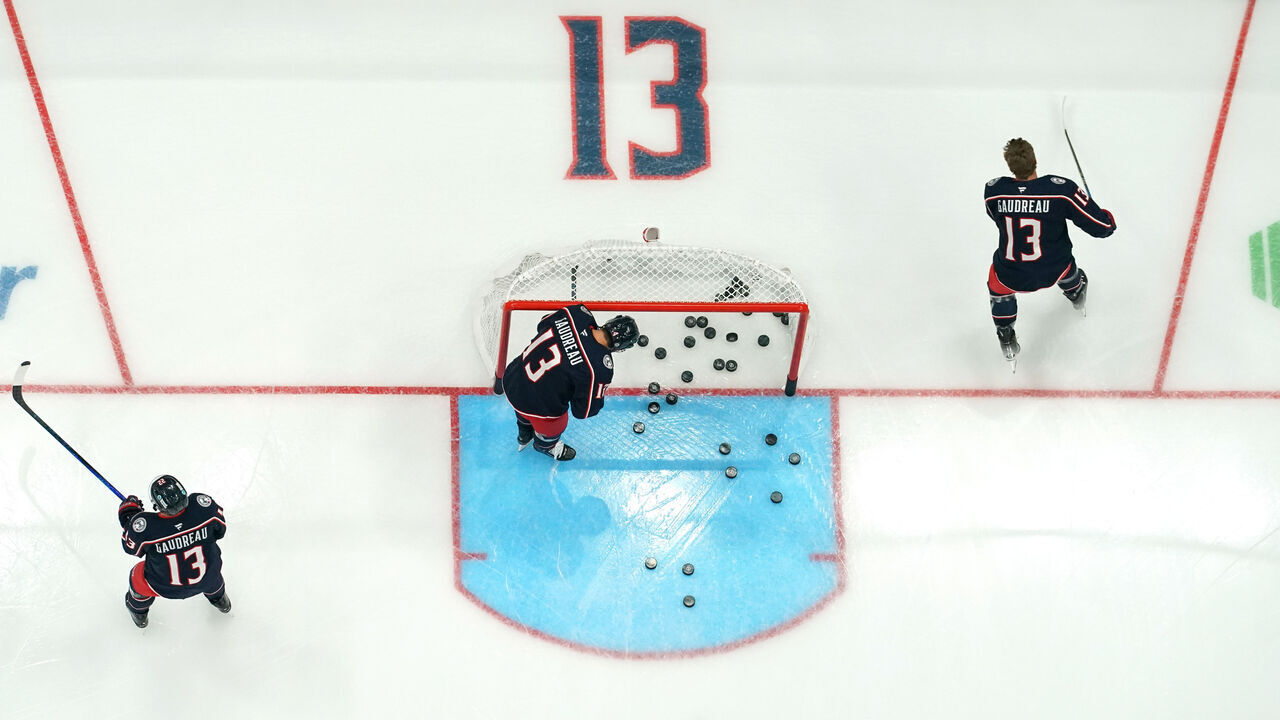 COLUMBUS, OHIO - OCTOBER 15: Columbus Blue Jackets players warm up before the game against the Florida Panthers at Nationwide Arena on October 15, 2024 in Columbus, Ohio. Players from both teams are wearing #13 in warm up jerseys in remembrance of Blue Jackets player Johnny Gaudreau, who along with his brother, was killed by a driver while biking in Salem County, New Jersey in August.