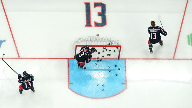 COLUMBUS, OHIO - OCTOBER 15: Columbus Blue Jackets players warm up before the game against the Florida Panthers at Nationwide Arena on October 15, 2024 in Columbus, Ohio. Players from both teams are wearing #13 in warm up jerseys in remembrance of Blue Jackets player Johnny Gaudreau, who along with his brother, was killed by a driver while biking in Salem County, New Jersey in August.