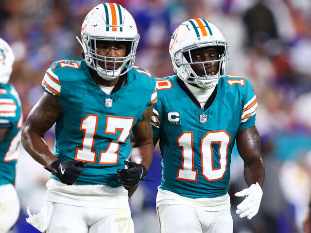 MIAMI GARDENS, FLORIDA - SEPTEMBER 12: Jaylen Waddle #17 and Tyreek Hill #10 of the Miami Dolphins looks on during the first quarter of the game against the Buffalo Bills at Hard Rock Stadium on September 12, 2024 in Miami Gardens, Florida.
