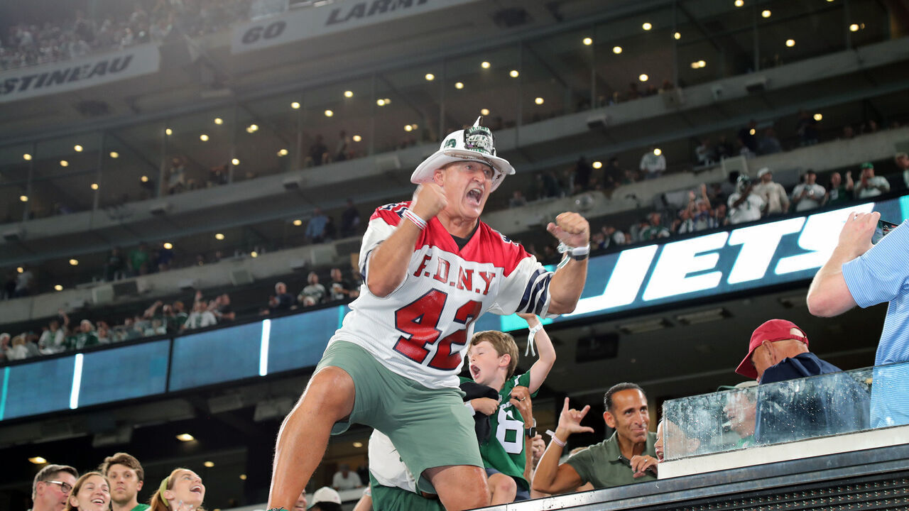 EAST RUTHERFORD, NEW JERSEY - SEPTEMBER 11: "Fireman Ed" Ed Anzalone leads the crowd in a cheer when he attends the Buffalo Bills vs New York Jets Season-Opening game at MetLife Stadium on September 11, 2023 in East Rutherford, New Jersey.