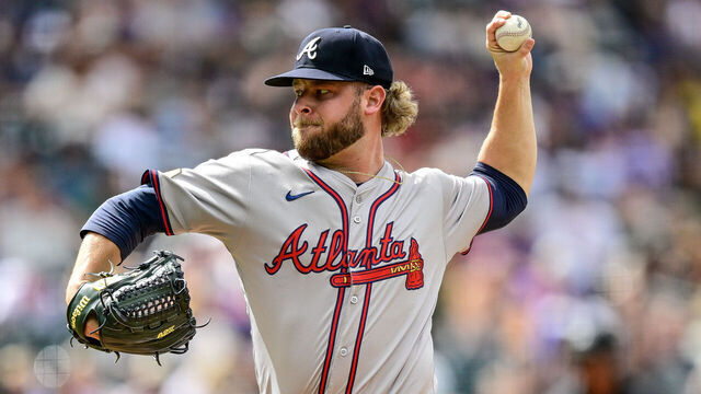 DENVER, COLORADO - AUGUST 11: A.J. Minter #33 of the Atlanta Braves pitches against the Colorado Rockies in the seventh inning at Coors Field on August 11, 2024 in Denver, Colorado.