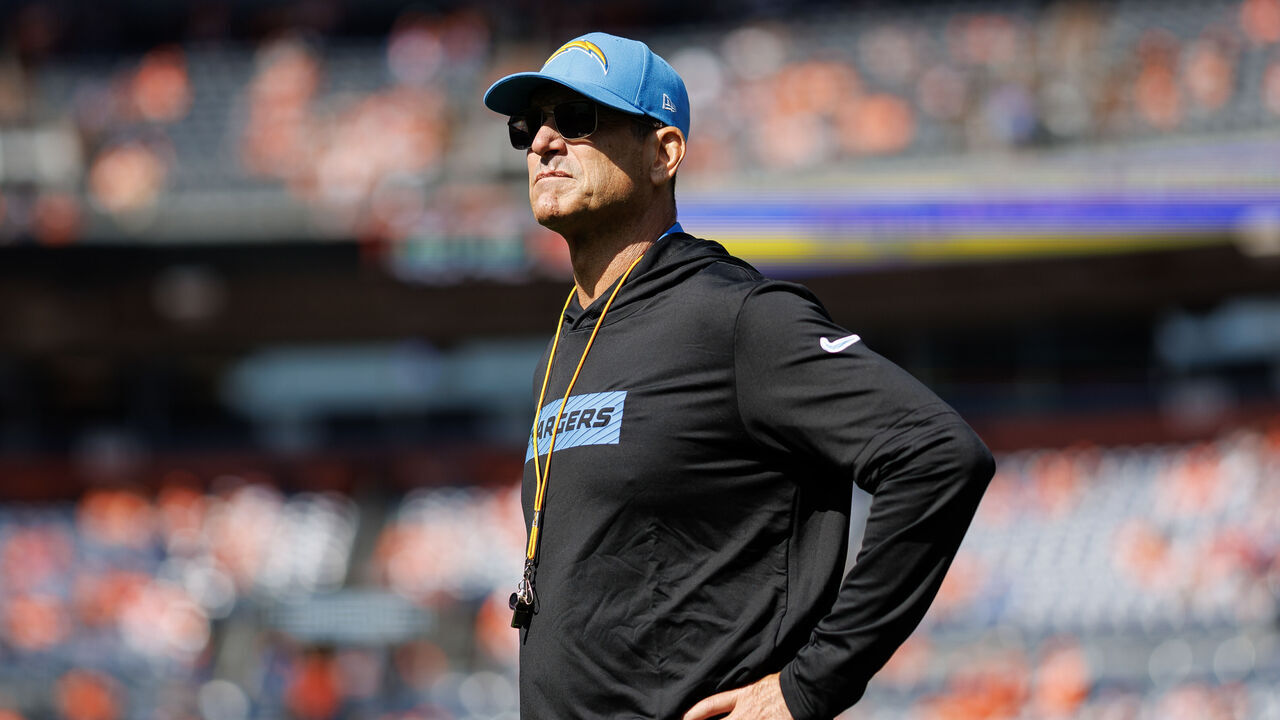 DENVER, COLORADO - OCTOBER 13: Head coach Jim Harbaugh of the Los Angeles Chargers stands on the field prior to an NFL football game against the Denver Broncos at Empower Field at Mile High on October 13, 2024 in Denver, Colorado.