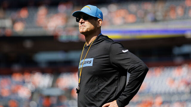 DENVER, COLORADO - OCTOBER 13: Head coach Jim Harbaugh of the Los Angeles Chargers stands on the field prior to an NFL football game against the Denver Broncos at Empower Field at Mile High on October 13, 2024 in Denver, Colorado.