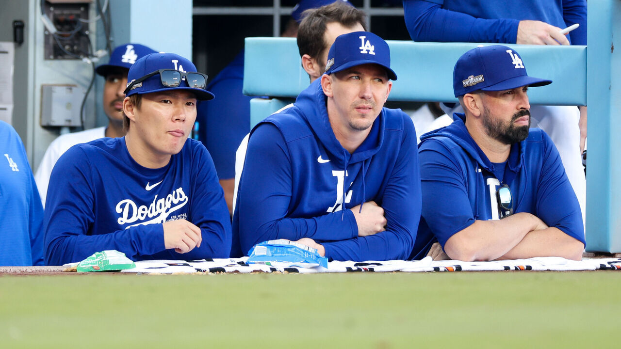 LOS ANGELES, CALIFORNIA - OCTOBER 14: Yoshinobu Yamamoto #18 of the Los Angeles Dodgers watches the game with Walker Buehler #21 during the eighth inning in game two of the National League Championship Series against the New York Metsat Dodger Stadium on Monday, Oct. 14, 2024 in Los Angeles. (Wally Skalij / Los Angeles Times via Getty Images)