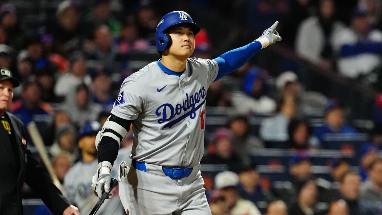 NEW YORK, NY - OCTOBER 16: Shohei Ohtani #17 of the Los Angeles Dodgers reacts after hitting a three RBI home run in the eighth inning during Game 3 of the NLCS presented by loanDepot between the Los Angeles Dodgers and the New York Mets at Citi Field on Wednesday, October 16, 2024 in New York, New York.