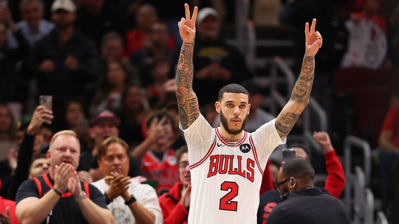 CHICAGO, ILLINOIS - OCTOBER 16: Lonzo Ball #2 of the Chicago Bulls acknowledges the crowd as he enters the preseason game against the Minnesota Timberwolves at the United Center on October 16, 2024 in Chicago, Illinois.