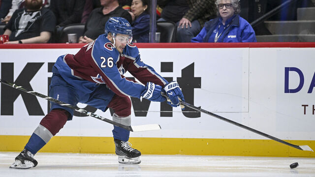 DENVER, CO - OCTOBER 1: Erik Brannstrom (26) of the Colorado Avalanche chases down the puck during the first period at Ball Arena in Denver on Tuesday, October 1, 2024.
