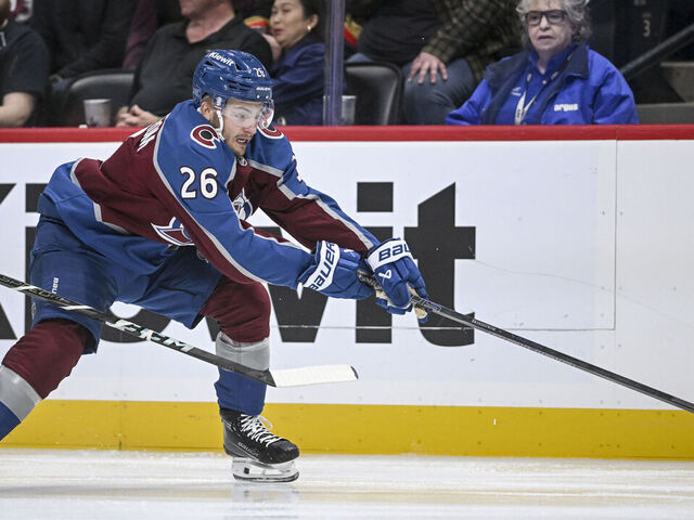 DENVER, CO - OCTOBER 1: Erik Brannstrom (26) of the Colorado Avalanche chases down the puck during the first period at Ball Arena in Denver on Tuesday, October 1, 2024.
