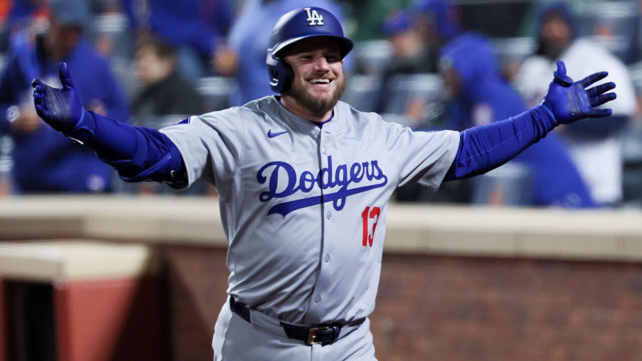 NEW YORK, NEW YORK - OCTOBER 16: Max Muncy #13 of the Los Angeles Dodgers celebrates while headed to the dugout after a solo home run during the ninth inning in game three of the National League Championship Series against the New York Mets at Citi Field on Wednesday, Oct. 16, 2024 in New York. (Robert Gauthier / Los Angeles Times via Getty Images)