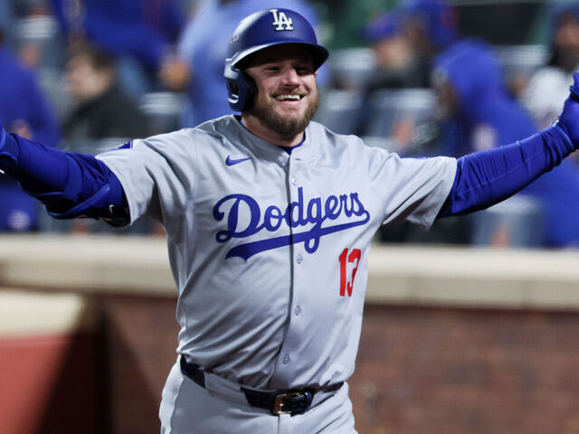 NEW YORK, NEW YORK - OCTOBER 16: Max Muncy #13 of the Los Angeles Dodgers celebrates while headed to the dugout after a solo home run during the ninth inning in game three of the National League Championship Series against the New York Mets at Citi Field on Wednesday, Oct. 16, 2024 in New York. (Robert Gauthier / Los Angeles Times via Getty Images)