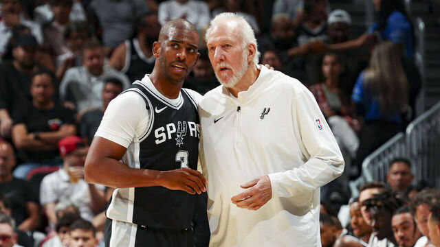 MIAMI, FL - OCTOBER 15: Head Coach Gregg Popovich of the San Antonio Spurs speaks with Chris Paul #3 during the game on October 15, 2024 at Kaseya Center in Miami, Florida. Mandatory Copyright Notice: Copyright 2024 NBAE