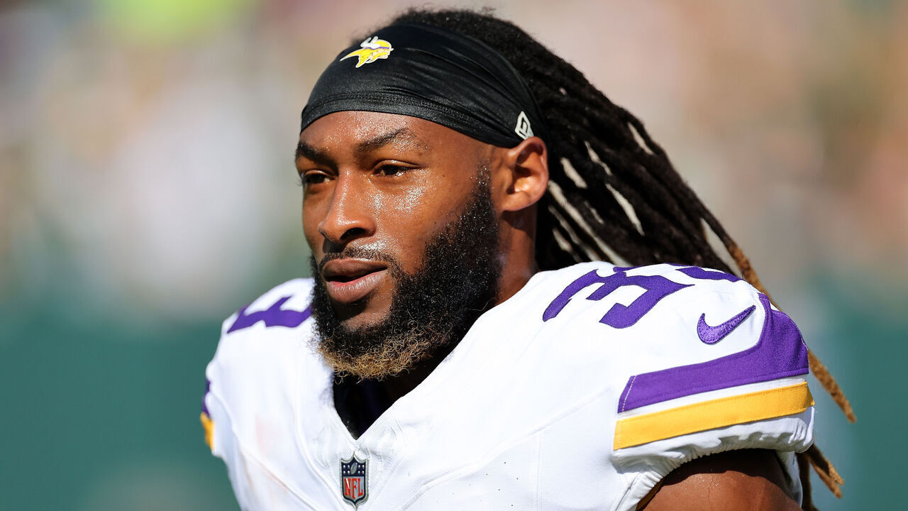 GREEN BAY, WISCONSIN - SEPTEMBER 29: Aaron Jones #33 of the Minnesota Vikings participates in warmups prior to a game against the Green Bay Packers at Lambeau Field on September 29, 2024 in Green Bay, Wisconsin.