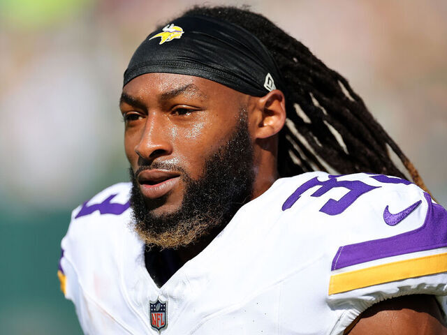 GREEN BAY, WISCONSIN - SEPTEMBER 29: Aaron Jones #33 of the Minnesota Vikings participates in warmups prior to a game against the Green Bay Packers at Lambeau Field on September 29, 2024 in Green Bay, Wisconsin.