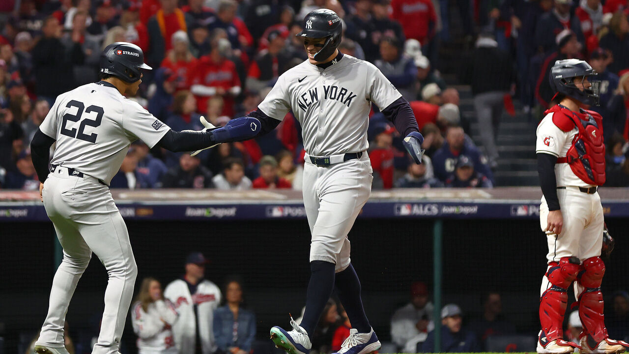 CLEVELAND, OHIO - OCTOBER 18: Giancarlo Stanton #27 of the New York Yankees celebrates with Juan Soto #22 after hitting a three-run home run in the sixth inning against the Cleveland Guardians during Game Four of the American League Championship Series at Progressive Field on October 18, 2024 in Cleveland, Ohio.