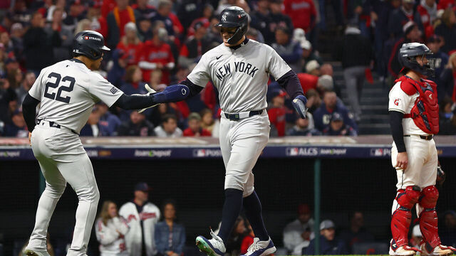 CLEVELAND, OHIO - OCTOBER 18: Giancarlo Stanton #27 of the New York Yankees celebrates with Juan Soto #22 after hitting a three-run home run in the sixth inning against the Cleveland Guardians during Game Four of the American League Championship Series at Progressive Field on October 18, 2024 in Cleveland, Ohio.