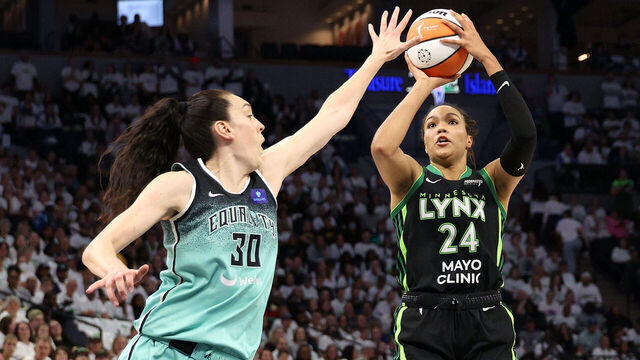 MINNEAPOLIS, MINNESOTA - OCTOBER 16: Napheesa Collier #24 of the Minnesota Lynx shoots the ball against Breanna Stewart #30 of the New York Liberty during the second quarter in Game Three of the WNBA Finals at Target Center on October 16, 2024 in Minneapolis, Minnesota.
