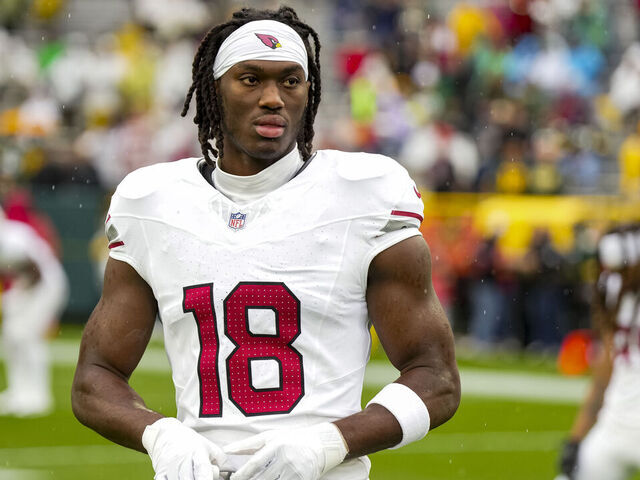 GREEN BAY, WISCONSIN - OCTOBER 13: Wide receiver Marvin Harrison Jr. #18 of the Arizona Cardinals stands on the field prior to an NFL football game against the Green Bay Packers, at Lambeau Field on October 13, 2024 in Green Bay, Wisconsin.