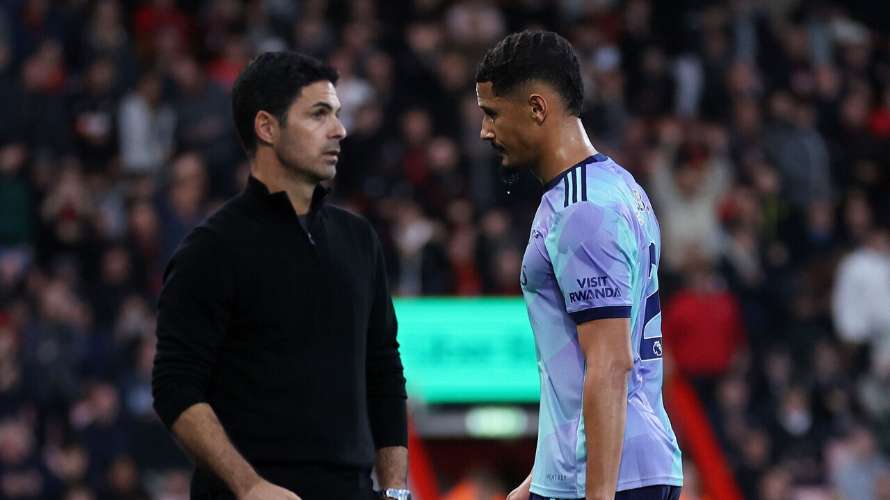 BOURNEMOUTH, ENGLAND - OCTOBER 19: William Saliba of Arsenal past Mikel Arteta manager / head coach of Arsenal as he walks off after being shown a red card during the Premier League match between AFC Bournemouth and Arsenal FC at Vitality Stadium on October 19, 2024 in Bournemouth, England.