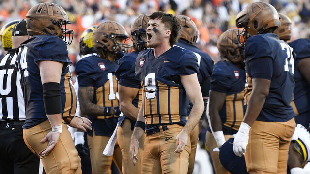 CHAMPAIGN, IL - OCTOBER 19: Illinois Fighting Illini Quarterback Luke Altmyer (9) celebrates after scoring a touchdown during the college football game between the Michigan Wolverines and the Illinois Fighting Illini on October 19, 2024, at Memorial Stadium, in Champaign, Illinois.