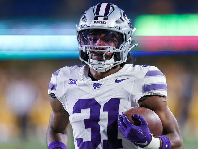 MORGANTOWN, WV - OCTOBER 19: Kansas State Wildcats running back DJ Giddens (31) warms up prior to the college football game between the Kansas State Wildcats and the West Virginia Mountaineers on October 19, 2024, at Mountaineer Field at Milan Puskar Stadium in Morgantown, WV.
