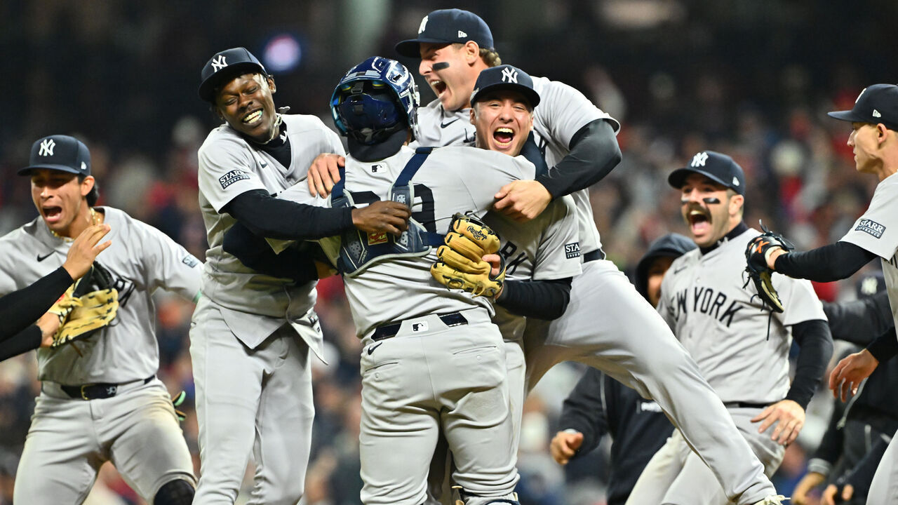 CLEVELAND, OHIO - OCTOBER 19: The New York Yankees celebrate after beating the Cleveland Guardians 5-2 in 10 innings to win Game Five of the American League Championship Series at Progressive Field on October 19, 2024 in Cleveland, Ohio.