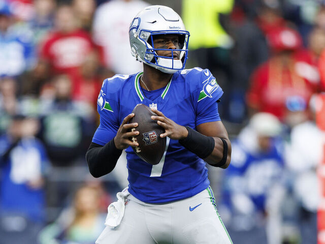 SEATTLE, WASHINGTON - OCTOBER 10: Quarterback Geno Smith #7 of the Seattle Seahawks drops back to pass during the first quarter of an NFL football game against the San Francisco 49ers, at Lumen Field on October 10, 2024 in Seattle, Washington.