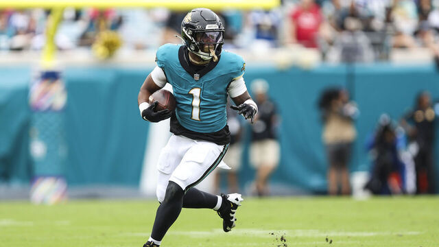 JACKSONVILLE, FLORIDA - OCTOBER 06: Travis Etienne Jr. #1 of the Jacksonville Jaguars runs with the ball during an NFL football game against the Indianapolis Colts at EverBank Stadium on October 6, 2024 in Jacksonville, Florida.