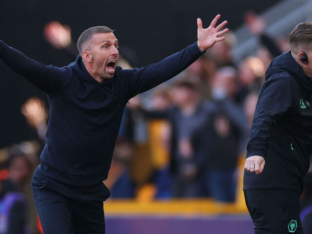 WOLVERHAMPTON, ENGLAND - OCTOBER 20: Gary O'Neil manager / head coach of Wolverhampton Wanderers and Assistant Tim Jenkins react as Pep Guardiola manager of Manchester City looks on during the Premier League match between Wolverhampton Wanderers FC and Manchester City FC at Molineux on October 20, 2024 in Wolverhampton, England.