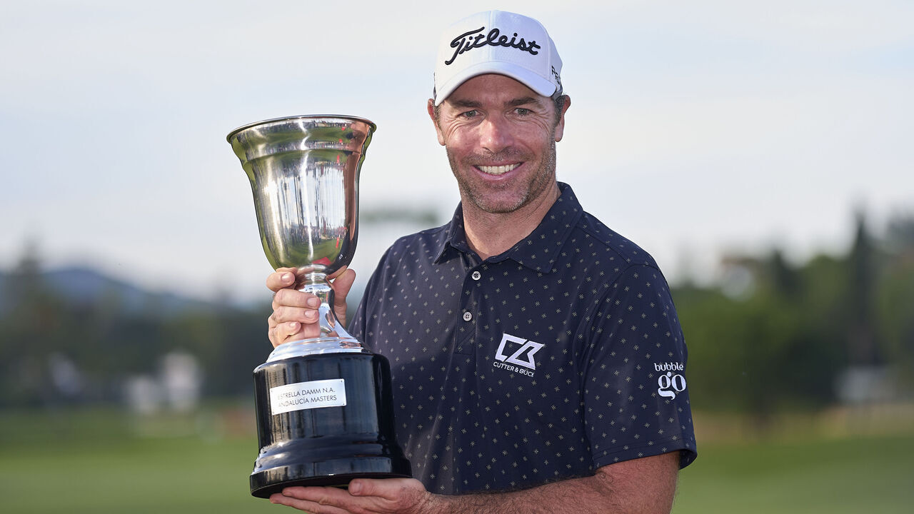 Julien Guerrier of France poses with the trophy on the 18th green following victory in a nine-hole play-off during day four of the Estrella Damm N.A. Andalucia Masters 2024 at Real Club de Golf Sotogrande in San Roque, Spain, on October 20, 2024.