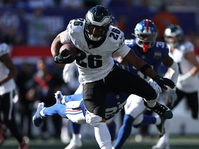 EAST RUTHERFORD, NEW JERSEY - OCTOBER 20: Saquon Barkley #26 of the Philadelphia Eagles runs the ball against the New York Giants during the third quarter at MetLife Stadium on October 20, 2024 in East Rutherford, New Jersey.