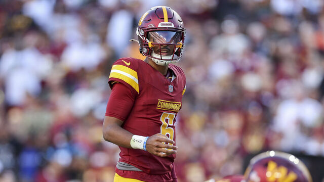 LANDOVER, MARYLAND - OCTOBER 20: Jayden Daniels #5 of the Washington Commanders looks on against the Carolina Panthers during the first quarter at FedExField on October 20, 2024 in Landover, Maryland.