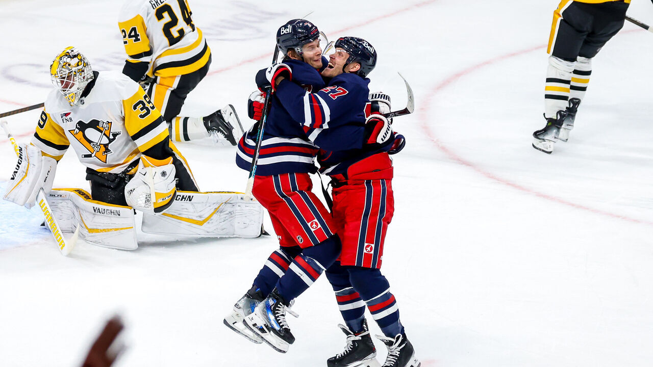 WINNIPEG, CANADA - OCTOBER 20: Vladislav Namestnikov #7 and Nikolaj Ehlers #27 of the Winnipeg Jets celebrate a second period goal against the Pittsburgh Penguins at the Canada Life Centre on October 20, 2024 in Winnipeg, Manitoba, Canada.
