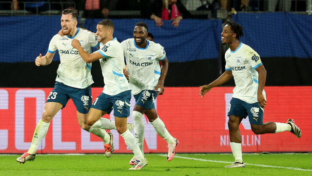 Marseille's Danish midfielder #23 Pierre-Emile Hojbjerg (L) celebrates with teammates after scoring his team's third goal during the French L1 football match between Montpellier Herault SC and Marseille (OM) at La Mosson stadium in Montpellier, southern France on October 20, 2024.