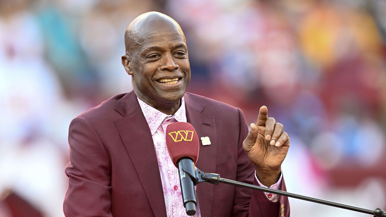 LANDOVER, MARYLAND - OCTOBER 20: Washington football legend Darrell Green is honored by the Washington Commanders during the ceremony to retire his number at FedExField during half time of the game between the Washington Commanders and the Carolina Panthers on October 20, 2024 in Landover, Maryland.