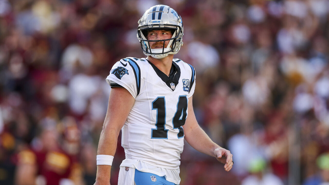 LANDOVER, MARYLAND - OCTOBER 20: Andy Dalton #14 of the Carolina Panthers reacts after throwing a pick six against the Washington Commanders during the first quarter at FedExField on October 20, 2024 in Landover, Maryland.