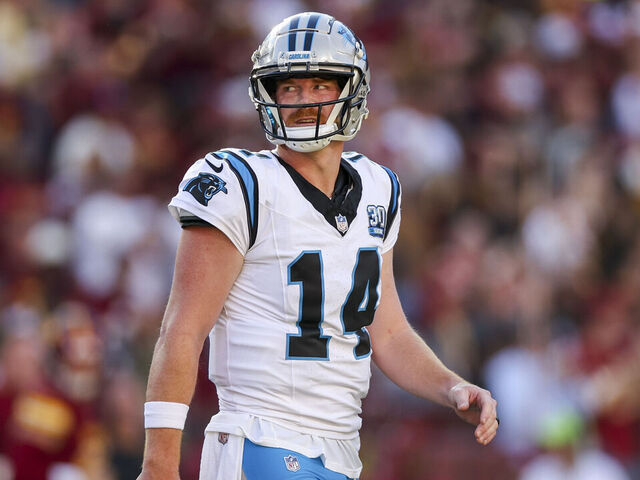 LANDOVER, MARYLAND - OCTOBER 20: Andy Dalton #14 of the Carolina Panthers reacts after throwing a pick six against the Washington Commanders during the first quarter at FedExField on October 20, 2024 in Landover, Maryland.