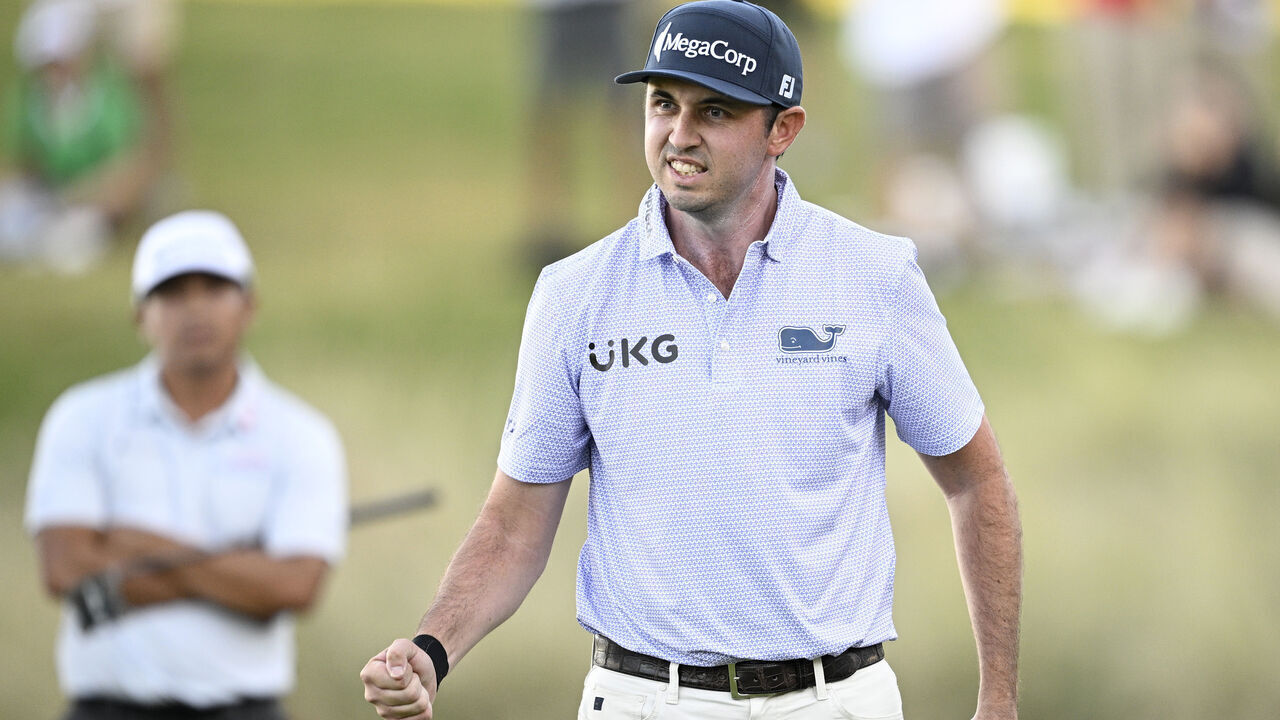 LAS VEGAS, NEVADA - OCTOBER 20: J.T. Poston of the United States reacts after his putt on the 18th green during the final round of the Shriners Children's Open 2024 at TPC Summerlin on October 20, 2024 in Las Vegas, Nevada.