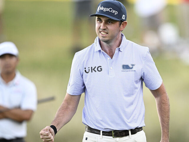 LAS VEGAS, NEVADA - OCTOBER 20: J.T. Poston of the United States reacts after his putt on the 18th green during the final round of the Shriners Children's Open 2024 at TPC Summerlin on October 20, 2024 in Las Vegas, Nevada.