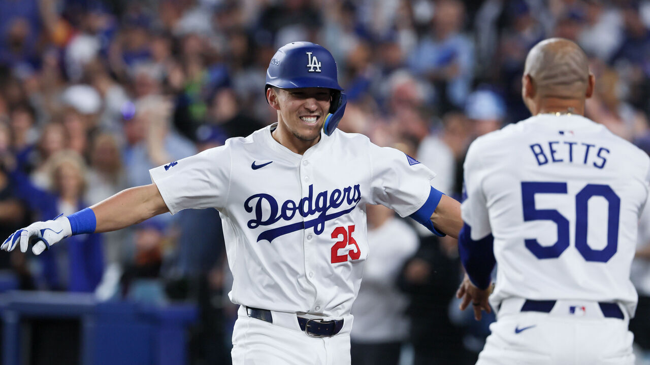 LOS ANGELES, CALIFORNIA - OCTOBER 20: Tommy Edman #25 of the Los Angeles Dodgers celebrates with Mookie Betts #50 after hitting a two-run home run during the third inning in game six of the National League Championship Series against the New York Mets at Dodger Field on Sunday, Oct. 20, 2024 in Los Angeles. (Robert Gauthier / Los Angeles Times via Getty Images)