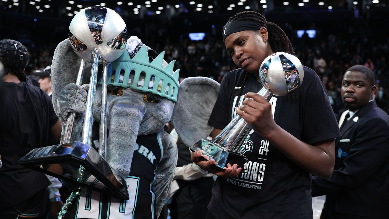 NEW YORK, NEW YORK - OCTOBER 20: Jonquel Jones #35 of the New York Liberty poses for a photo with the WBNA Finals MVP trophy after winning Game Five of the WNBA Finals at Barclays Center on October 20, 2024 in New York City.