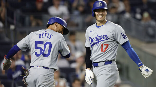 NEW YORK, NEW YORK - JUNE 08: Mookie Betts #50 and Shohei Ohtani #17 of the Los Angeles Dodgers celebrate after both scored in the ninth inning against the New York Yankees at Yankee Stadium on June 08, 2024 in New York City.