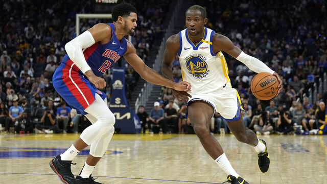 SAN FRANCISCO, CALIFORNIA - OCTOBER 13: Jonathan Kuminga #00 of the Golden State Warriors dribbling the ball is guarded by Tobias Harris #12 of the Detroit Pistons during the second half of an NBA preseason basketball game at Chase Center on October 13, 2024 in San Francisco, California.