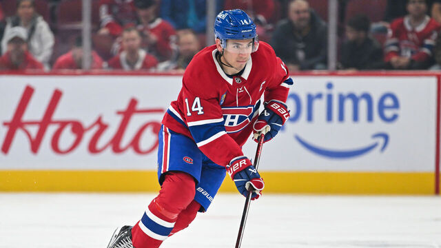 MONTREAL, CANADA - OCTOBER 14: Nick Suzuki #14 of the Montreal Canadiens skates the puck during the second period against the Pittsburgh Penguins at the Bell Centre on October 14, 2024 in Montreal, Quebec, Canada. The Pittsburgh Penguins defeated the Montreal Canadiens 6-3.
