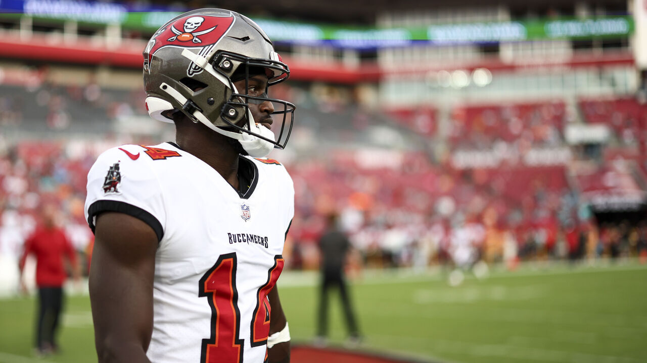 TAMPA, FL - AUGUST 23: Chris Godwin #14 of the Tampa Bay Buccaneers warms up prior to an NFL preseason football game against the Miami Dolphins at Raymond James Stadium on August 23, 2024 in Tampa, FL.