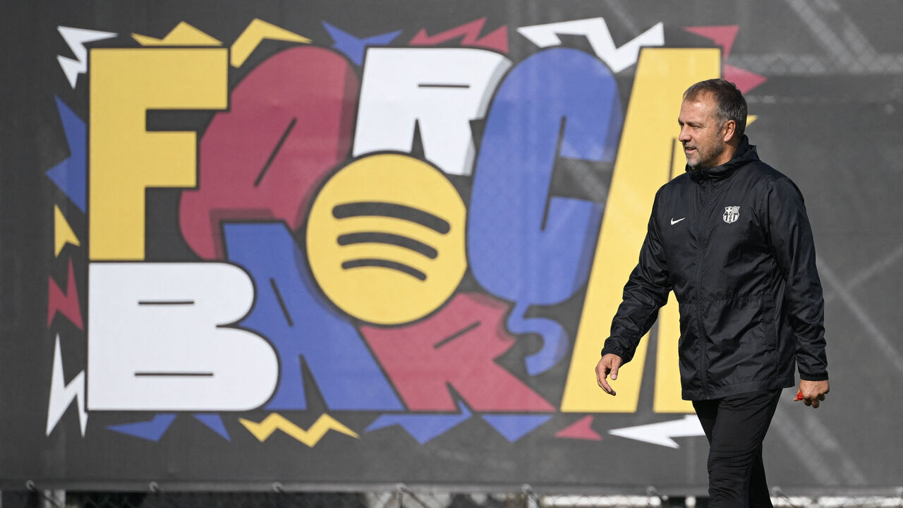 Barcelona's coach Hansi Flick heads a training session on the eve of the UEFA Champions League, league phase day 3 football match between FC Barcelona and FC Bayern Munich at the Joan Gamper training ground in Sant Joan Despi, near Barcelona, on October 22, 2024.
